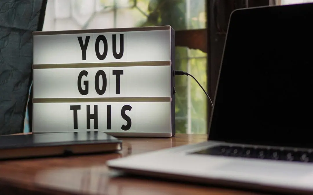 A light box on a desk next to a laptop that says "you got this" - perfect for a freelance web designer in Essex.