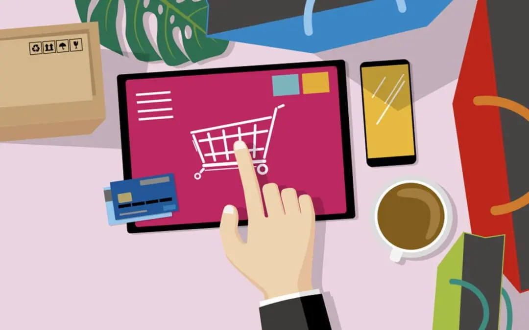 A hand holding a tablet with a shopping cart on it, designed by a freelance web designer from Essex.