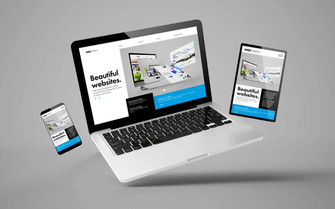 A laptop and tablet are displaying a website design by a freelance web designer.